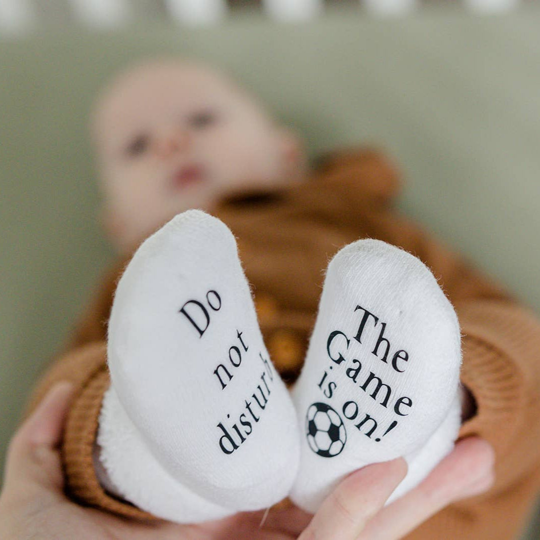 Do Not Disturb The Game is on Soccer Baby Socks