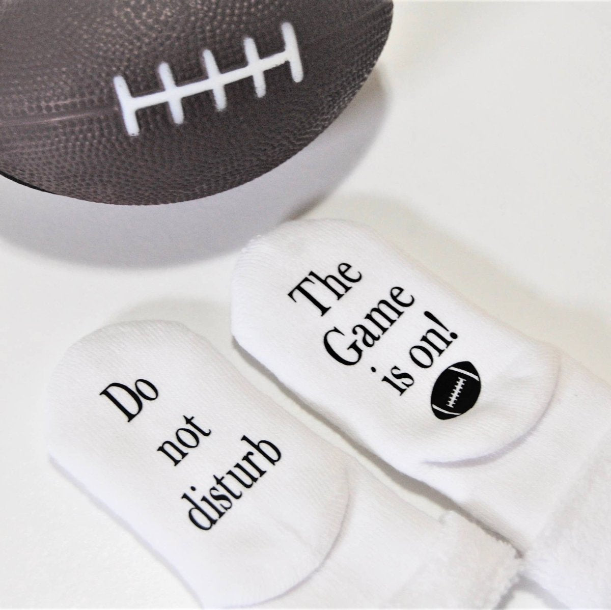 Do Not Disturb The Game is on Football Baby Socks