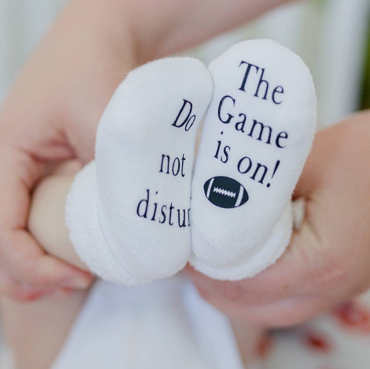 Do Not Disturb The Game is on Football Baby Socks