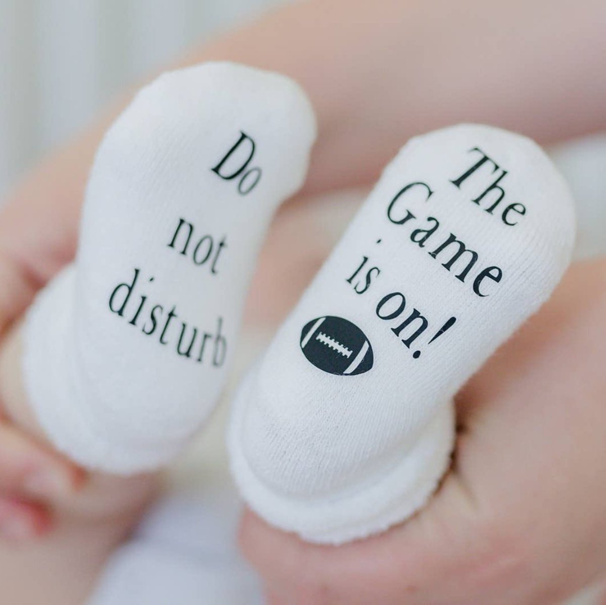 Do Not Disturb The Game is on Football Baby Socks